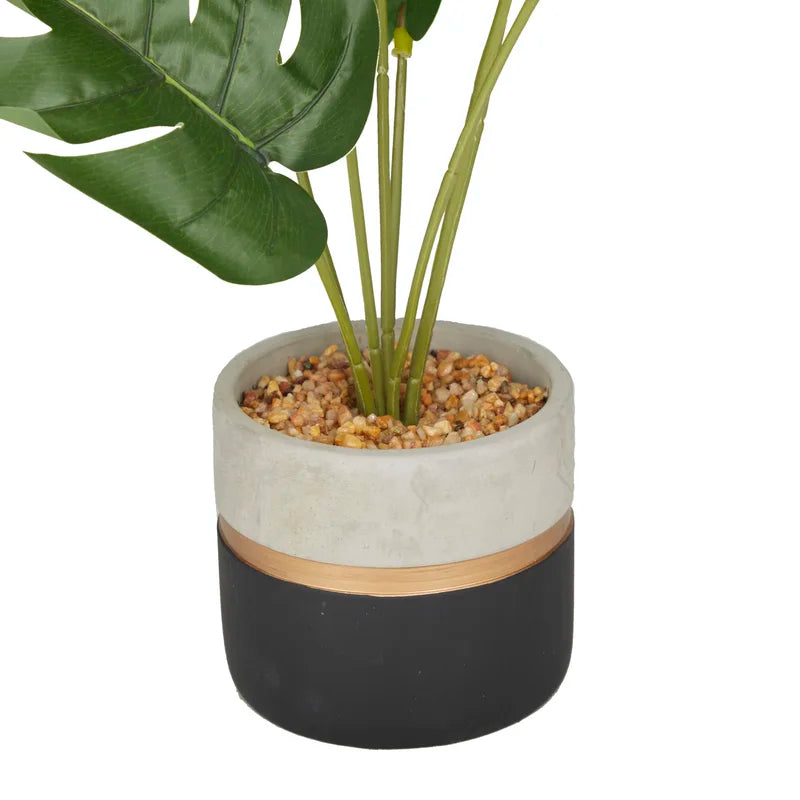 Vibrant green faux Monstera plant made from soft-touch fabric