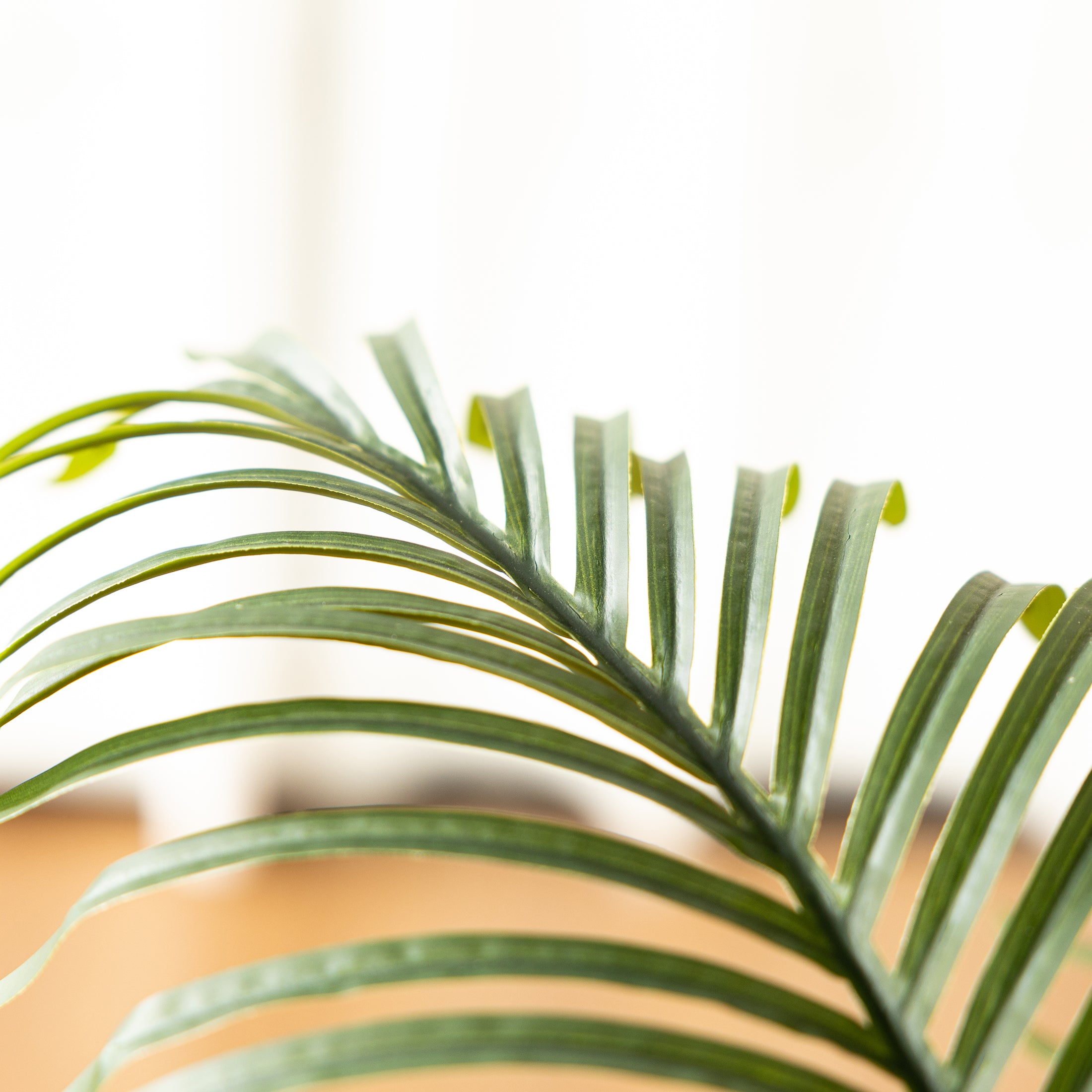 Realistic indoor Faux Palm Plant enhancing modern interiors with tropical charm