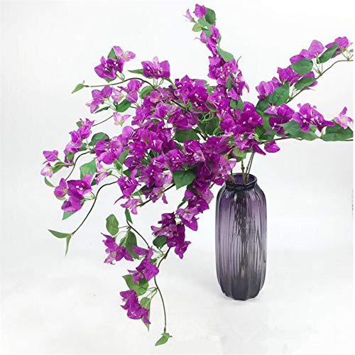 Purple bougainvillea artificial flowers in a dark vase on a white background