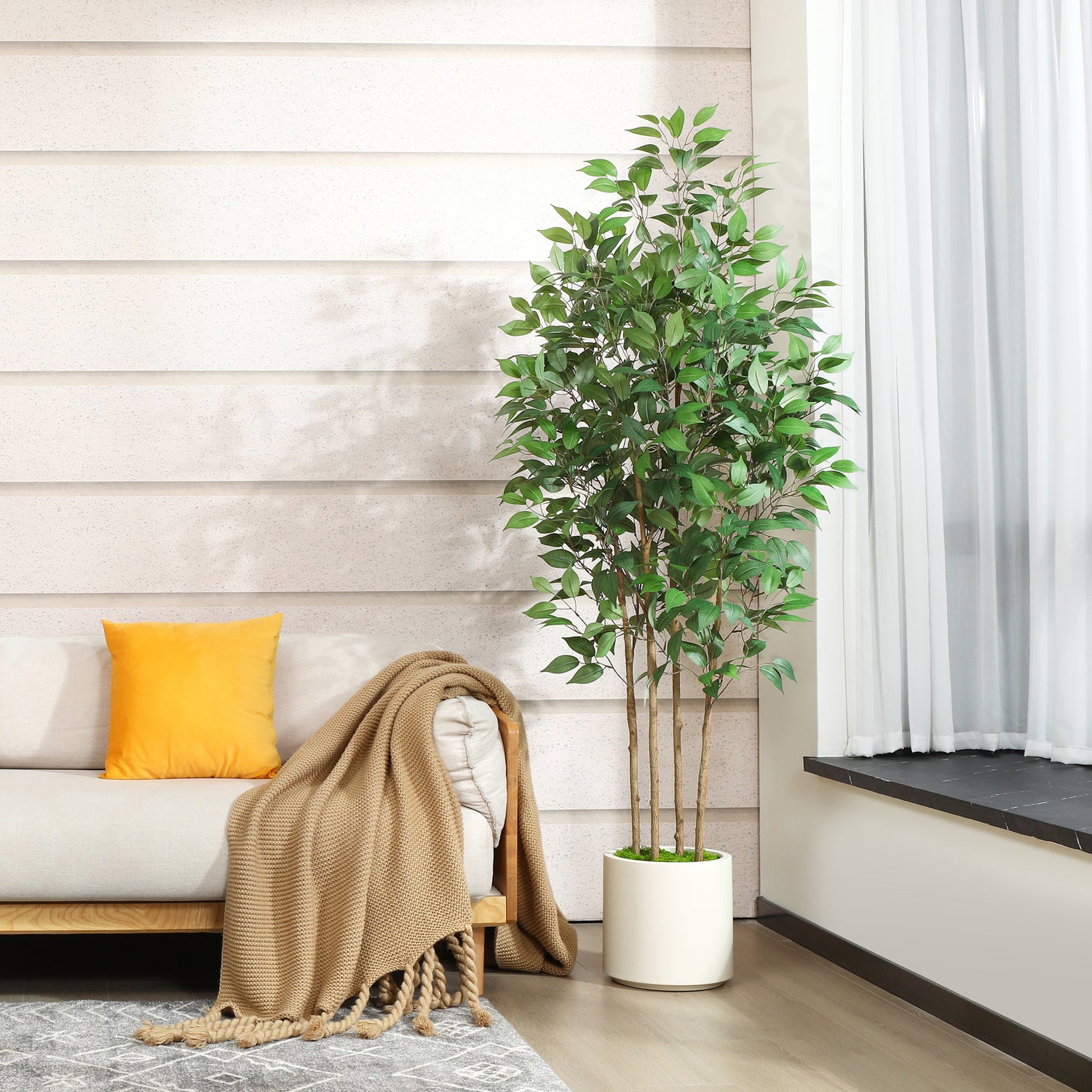 Lifelike faux ficus tree for home and office decor.