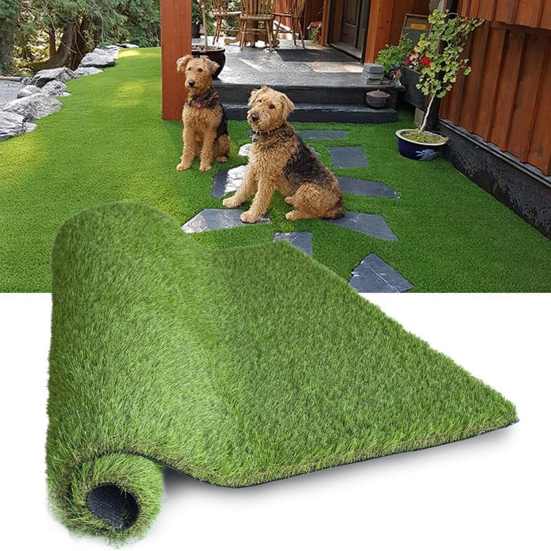 Two dogs on a patio with artificial grass and a roll of artificial grass in the foreground.
