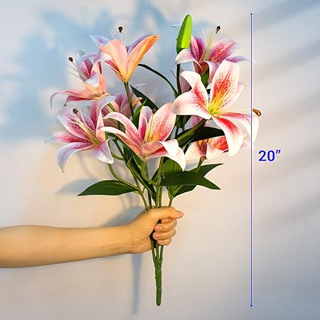Bouquet of pink and white lilies held by a hand with a measurement label indicating 20 inches.