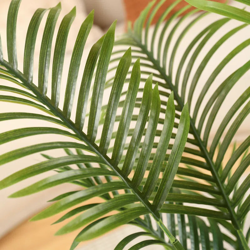 Maintenance-free artificial palm tree for indoor and outdoor spaces