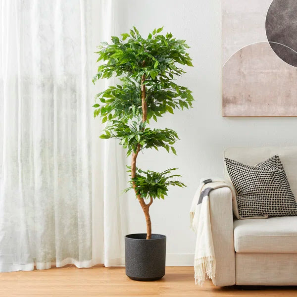 Easy-to-maintain faux ficus tree with vibrant green leaves and lifelike texture.