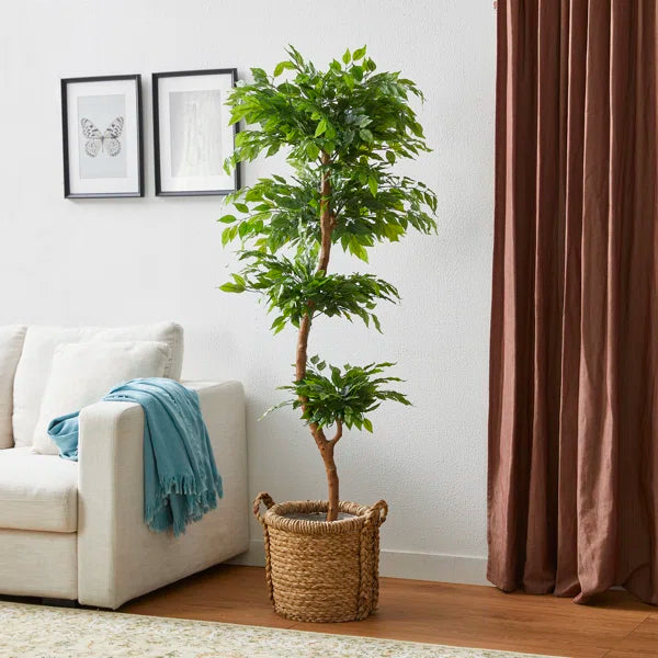 Lifelike 5ft faux ficus tree with lush green leaves for home and office decor.