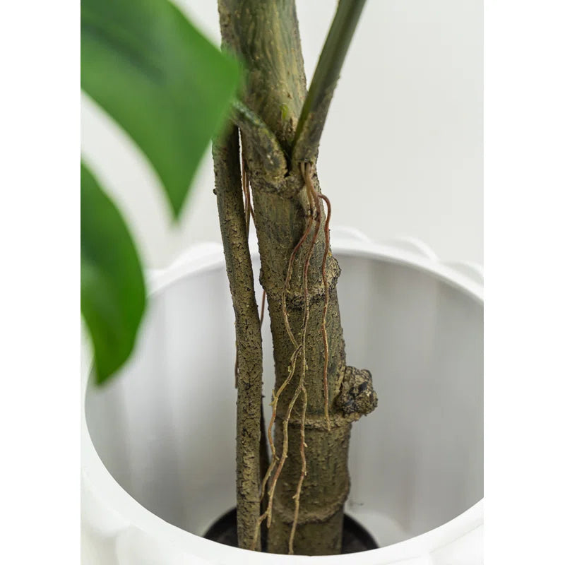 Lifelike artificial Monstera plant featuring realistic split leaves