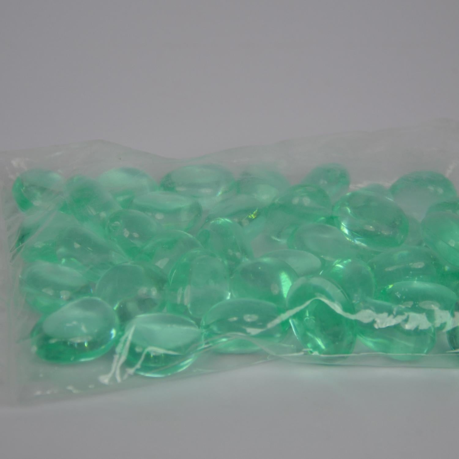 Bag of green beads on a white background