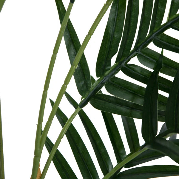 Vibrant green artificial fern plant designed to bring a fresh, organic feel to any space.