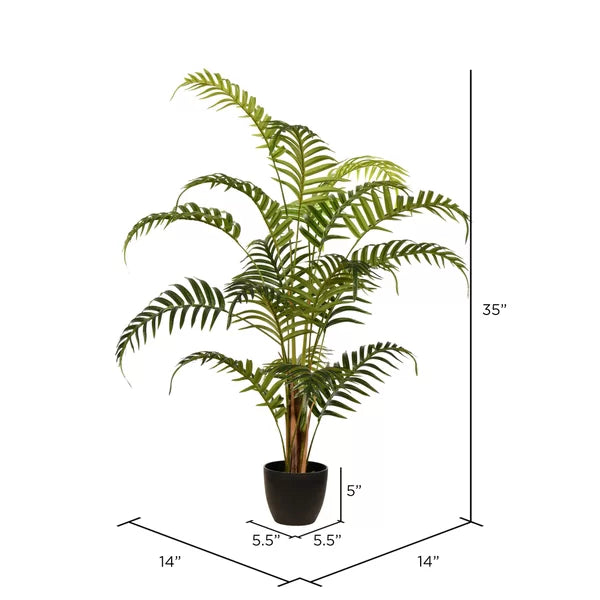 Decorative artificial fern plant with realistic texture and rich green foliage."