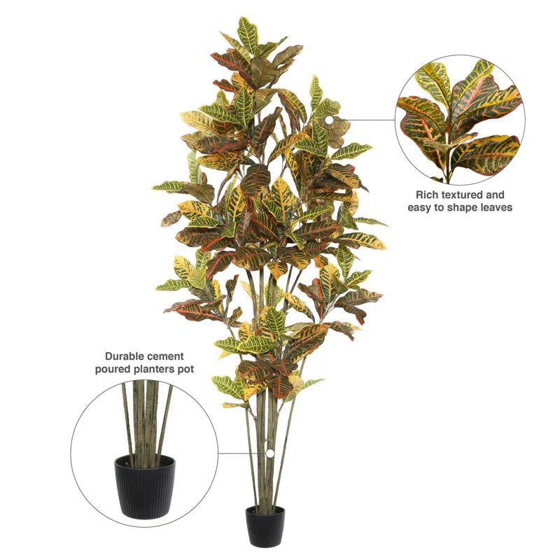 Lifelike artificial Croton tree featuring vibrant green and orange leaves