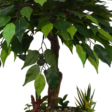 Artificial bonsai tree with green leaves on a white background