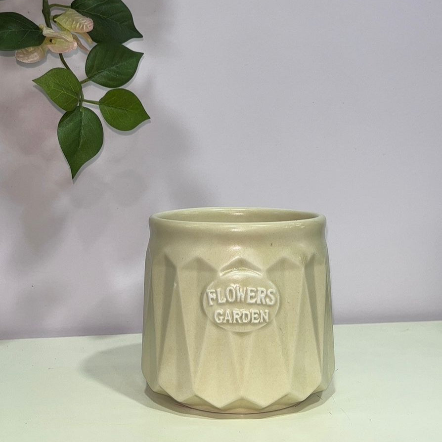 Beige ceramic pot with &
