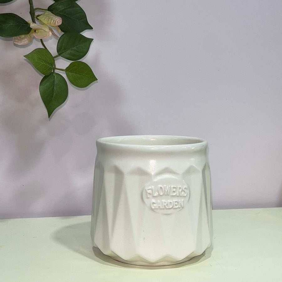 White ceramic pot with &
