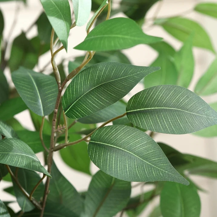 Low-maintenance faux ficus tree perfect for residential and commercial spaces.