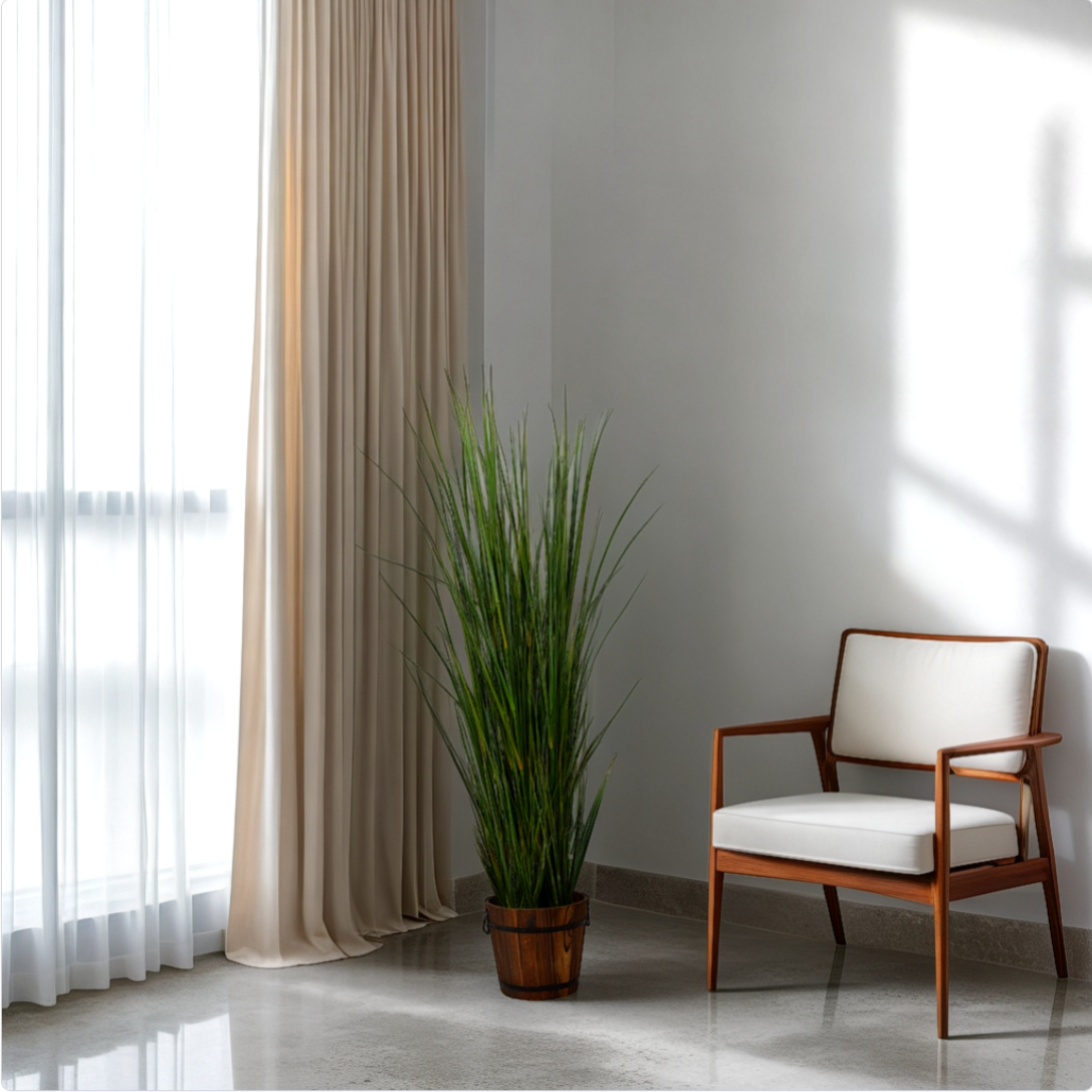 Modern interior design with a chair, plant, and large window.