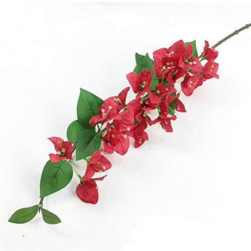 Artificial red flower branch with green leaves on a white background