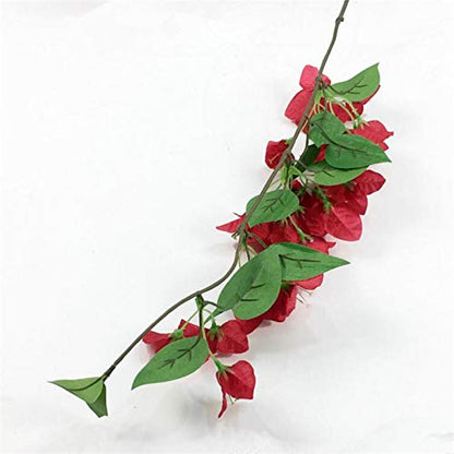 Artificial red bougainvillea flower branch with green leaves on a white background