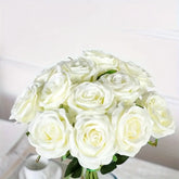 Bouquet of white roses on a light background