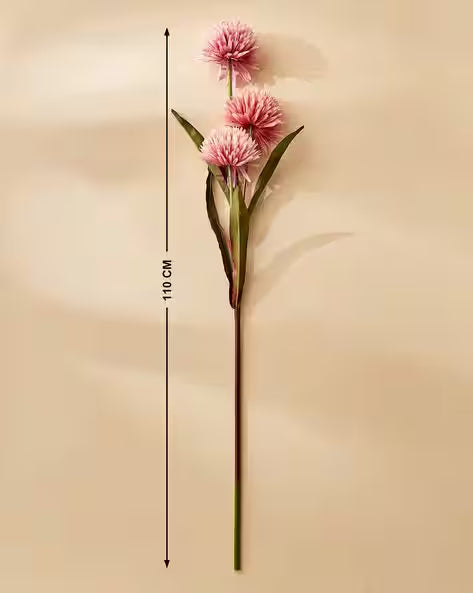 Pink artificial flower with measurement on a beige background