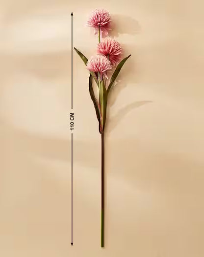 Pink artificial flower with measurement on a beige background