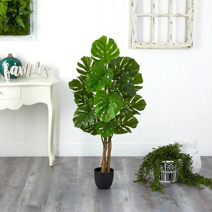 Realistic faux monstera tree featuring vibrant green leaves, ideal for tropical-themed indoor spaces