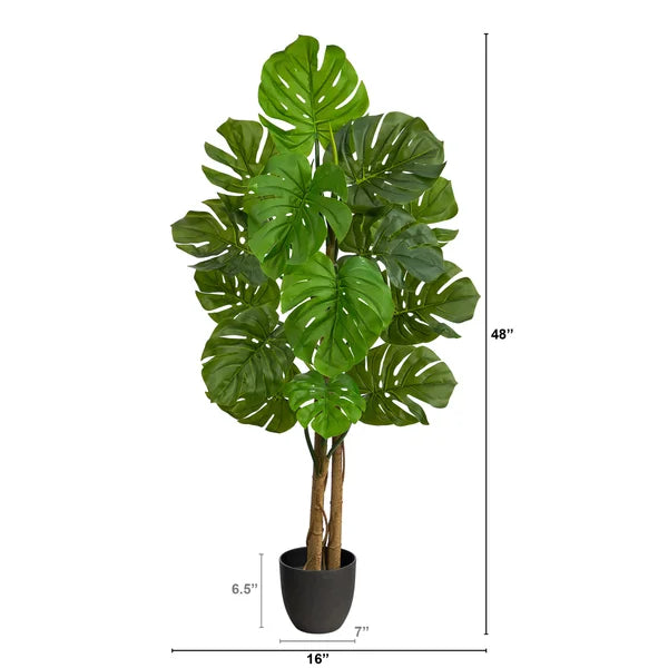 Artificial monstera plant with wide, detailed leaves, designed for a lush and refreshing aesthetic