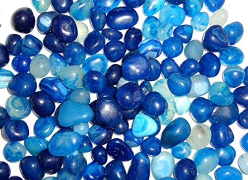 Assorted blue pebbles on a white background