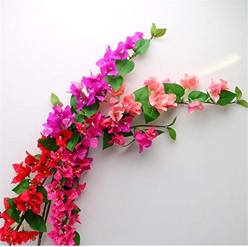 Artificial flower garland with pink, red, and green leaves on a white background
