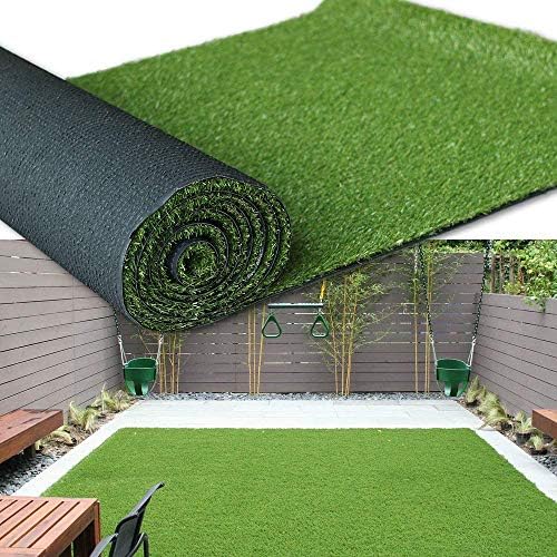 Roll of artificial grass with a garden setting in the background