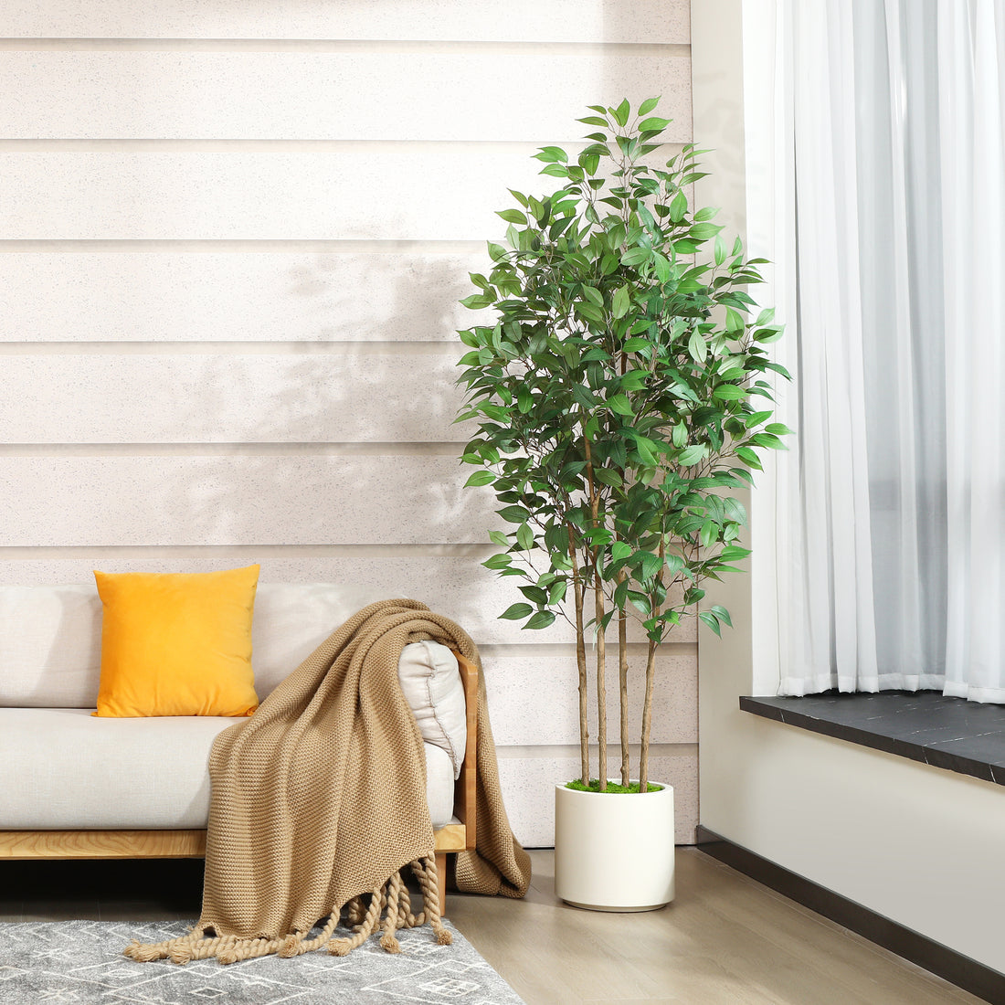 Lifelike faux ficus tree for home and office decor.