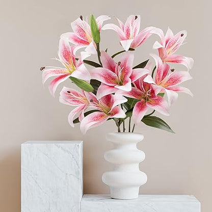 White vase with pink and white flowers on a neutral background