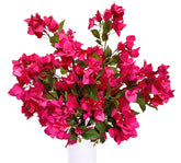 Bouquet of pink flowers in a white vase on a white background