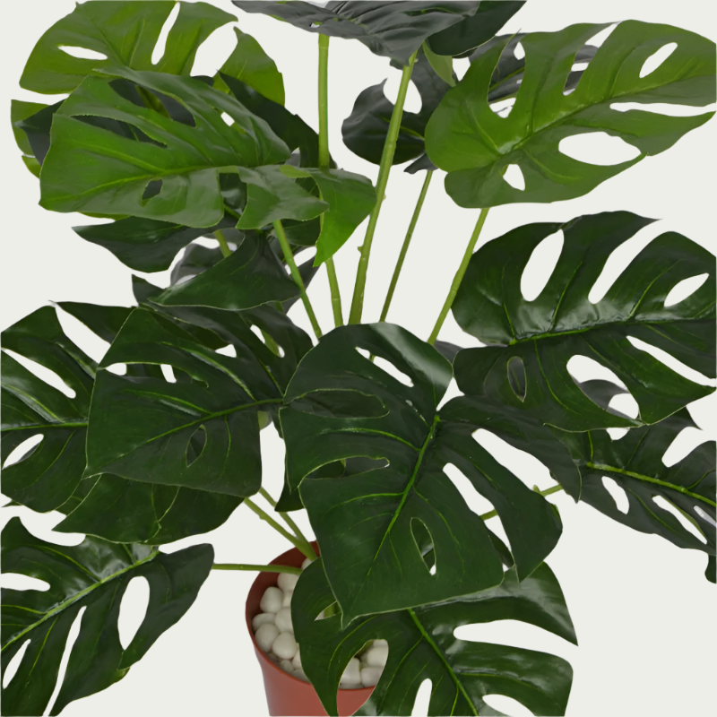 Decorative shot highlighting the unique design of 2 Ft Monstera Bush Realistic Nature-Inspired Shrub – Maintenance-Free Natural Look Accent – Shop Luxiplant.