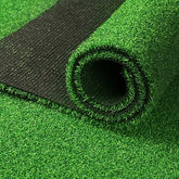 Roll of green artificial grass with a black backing