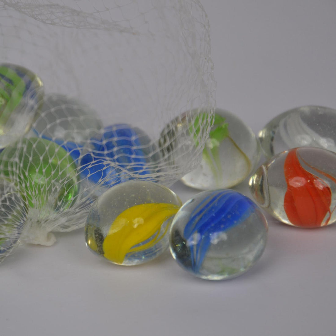 Colorful glass marbles on a white background