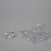 Clear plastic beads with a clear plastic bag on a gray background