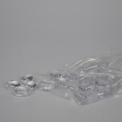 Clear plastic beads with a clear plastic bag on a gray background