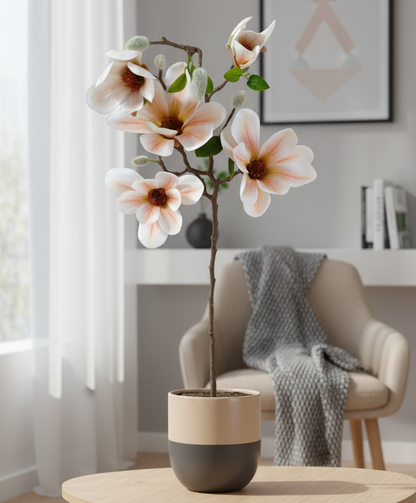 Modern living room with a coffee table, armchair, and decorative elements.