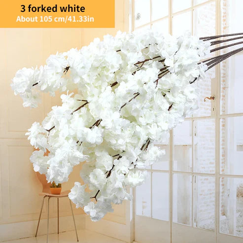 White artificial flowers with text indicating &