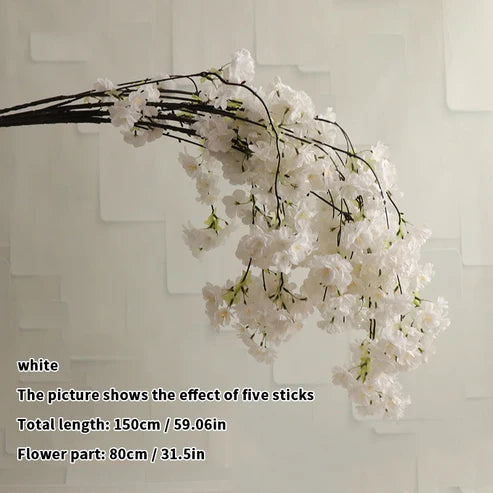 White floral branch against a light background