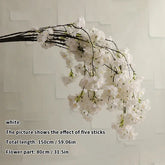 White floral branch against a light background