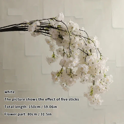 White floral branch against a light background