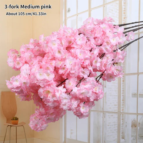 Pink artificial cherry blossom flower branch with text indicating size and color.