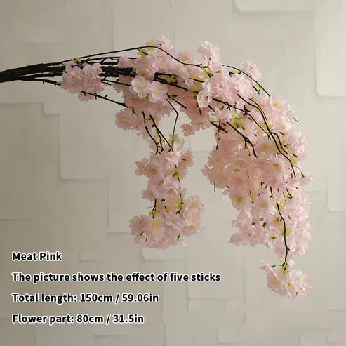 Cherry blossom pink artificial flower branch on a white background