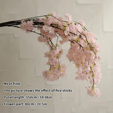 Cherry blossom pink artificial flower branch on a white background