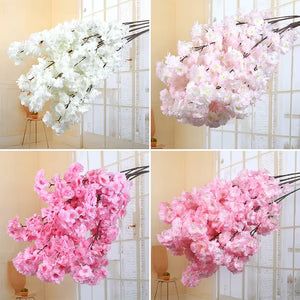 Four different views of pink and white artificial cherry blossom branches against a neutral background.