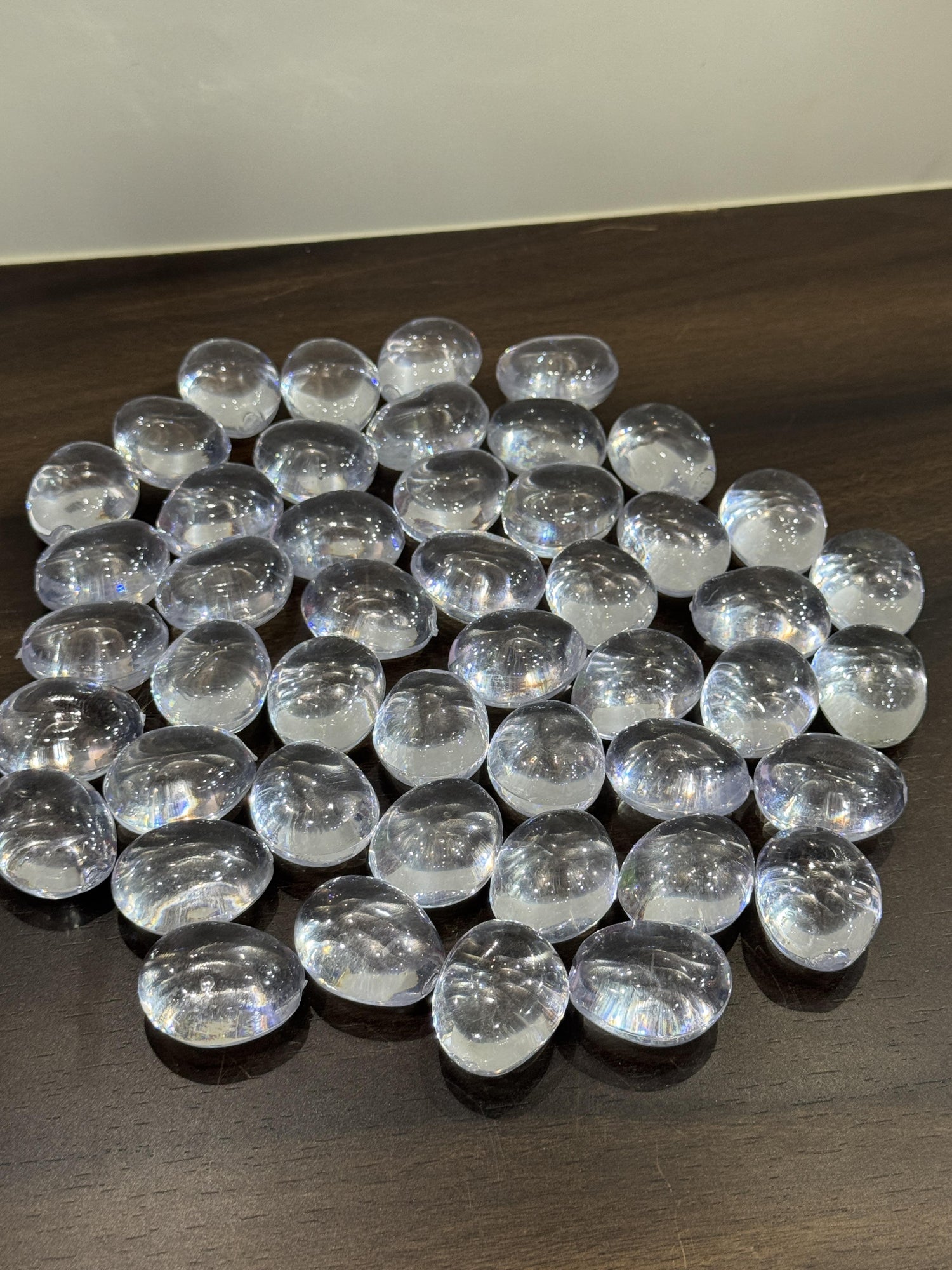 Clear glass marbles on a dark surface