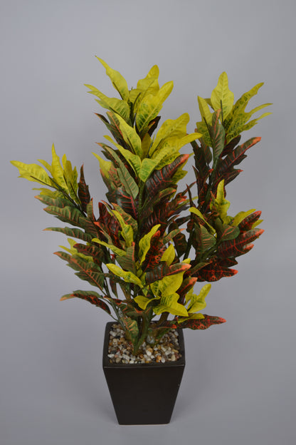 Realistic faux yellow croton plant for indoor décor
