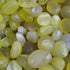 Close-up of green pebble stones with a focus on texture and color.