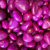 Close-up of pinkish-purple stones with a glossy finish